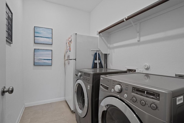 600 Spurlock Way, Liberty Hill, TX 78642 - laundry area featuring independent washer and dryer and light tile patterned flooring