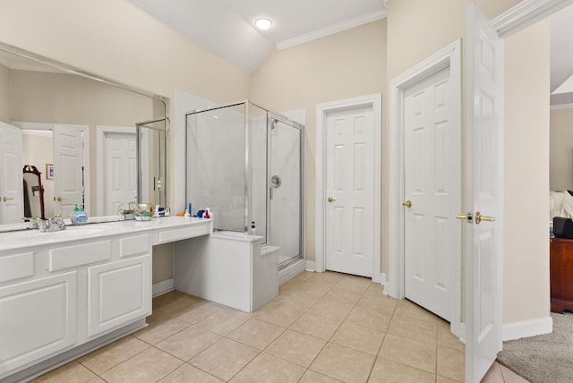 ensuite bathroom with a shower stall, tile patterned floors, ensuite bathroom, vanity, and ornamental molding