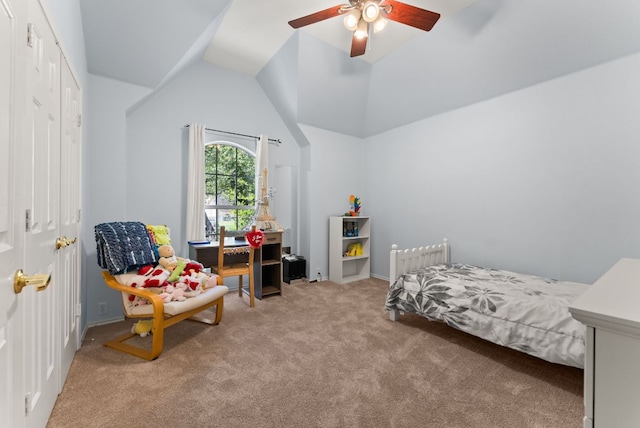 bedroom featuring carpet floors, lofted ceiling, and a ceiling fan