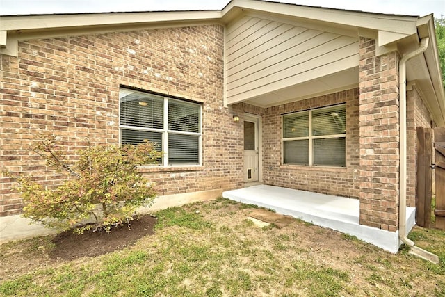 view of property exterior with brick siding