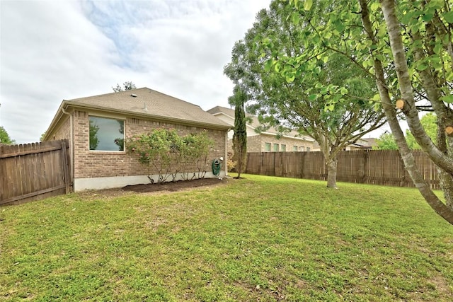 view of yard featuring a fenced backyard