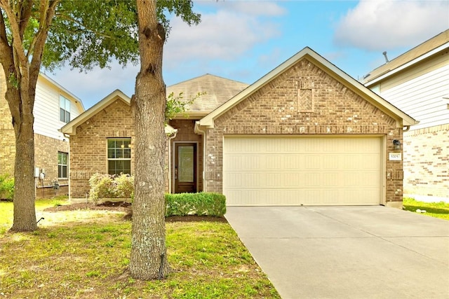 view of front of home with brick siding, driveway, and a garage