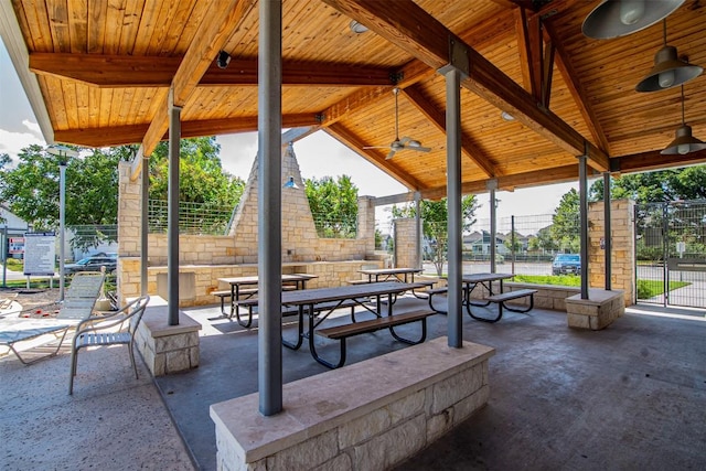 view of property's community featuring fence and a patio