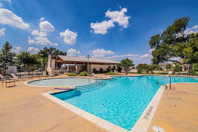 pool with a patio area