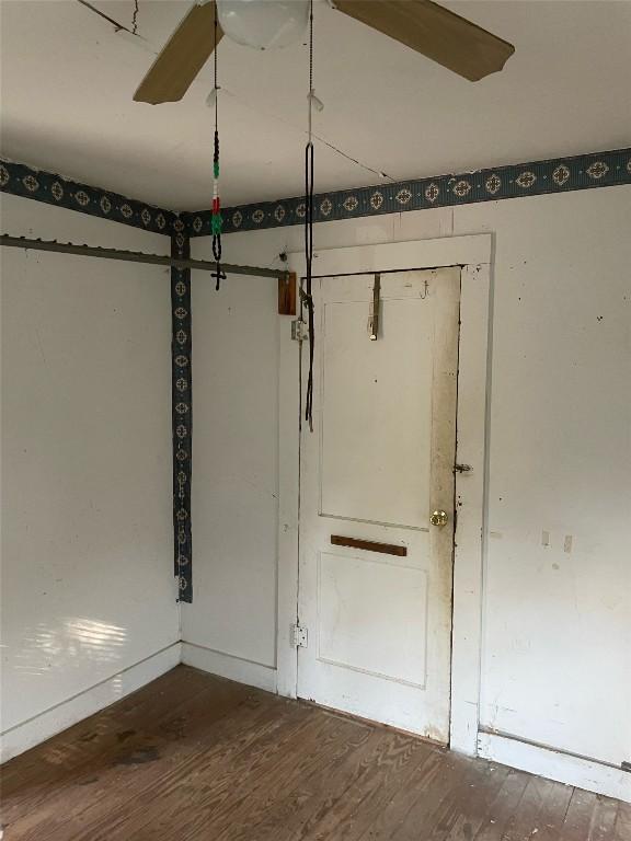 empty room featuring wood finished floors
