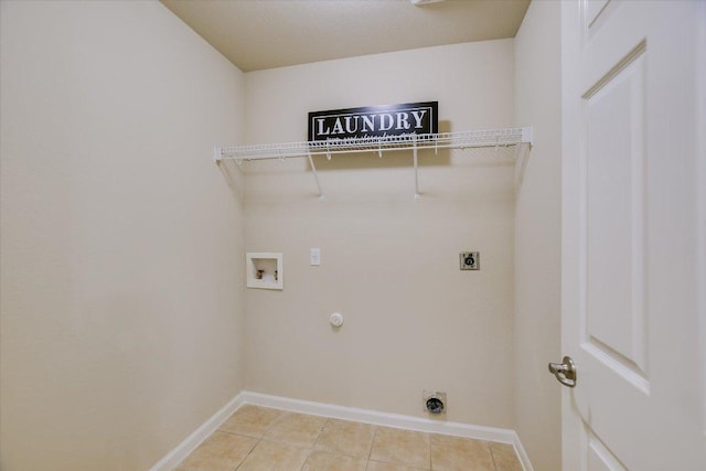 18301 Masi Loop, Pflugerville, TX 78660 - laundry area with hookup for an electric dryer, washer hookup, light tile patterned flooring, baseboards, and gas dryer hookup
