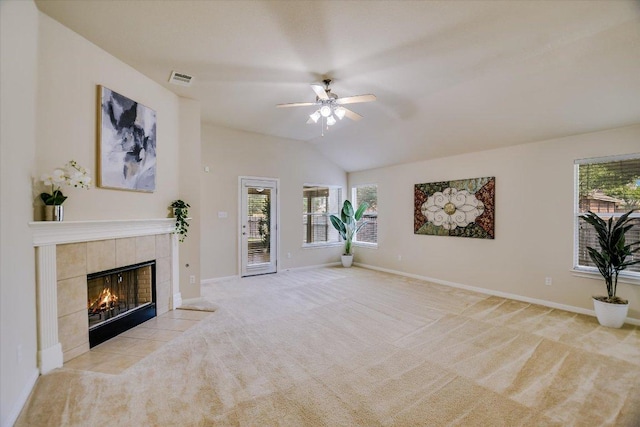 18301 Masi Loop, Pflugerville, TX 78660 - unfurnished living room featuring a ceiling fan, carpet, a fireplace, baseboards, and vaulted ceiling