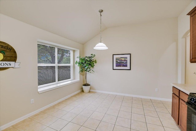 18301 Masi Loop, Pflugerville, TX 78660 - unfurnished dining area featuring lofted ceiling, baseboards, and light tile patterned floors