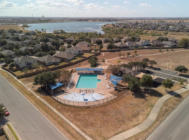 18301 Masi Loop, Pflugerville, TX 78660 - aerial perspective of suburban area featuring a pool and a large body of water