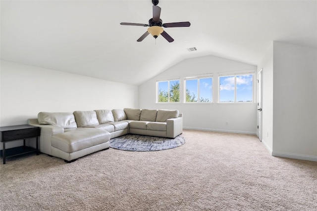 living area featuring a ceiling fan, baseboards, lofted ceiling, and carpet floors