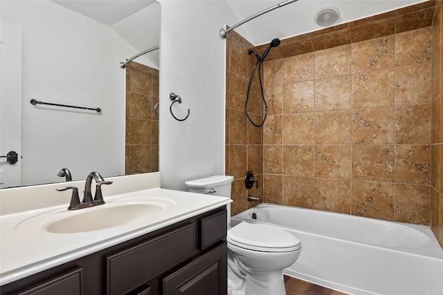 bathroom featuring wood finished floors, toilet, bathtub / shower combination, and vanity