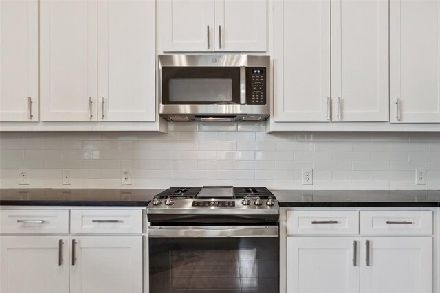 109 Perpetuation Dr, Austin, TX 78734 - kitchen featuring appliances with stainless steel finishes, white cabinetry, and backsplash