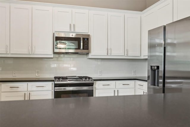 109 Perpetuation Dr, Austin, TX 78734 - kitchen with appliances with stainless steel finishes, dark countertops, white cabinetry, and backsplash