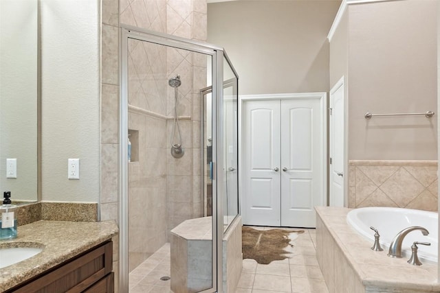 109 Perpetuation Dr, Austin, TX 78734 - full bathroom with a stall shower, a bath, vanity, and tile patterned floors