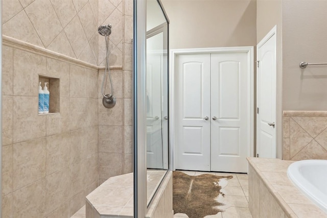109 Perpetuation Dr, Austin, TX 78734 - bathroom featuring a tile shower, a garden tub, and tile patterned floors