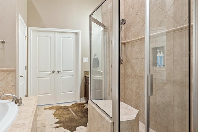 109 Perpetuation Dr, Austin, TX 78734 - bathroom featuring a stall shower, a garden tub, and vanity