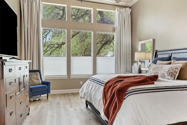 109 Perpetuation Dr, Austin, TX 78734 - bedroom with multiple windows, light wood finished floors, baseboards, and a towering ceiling