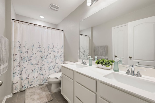 bathroom with visible vents, tile patterned flooring, and a sink