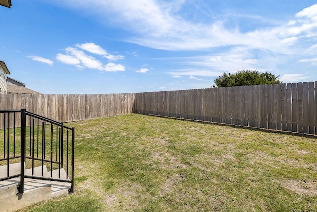 view of yard featuring a fenced backyard