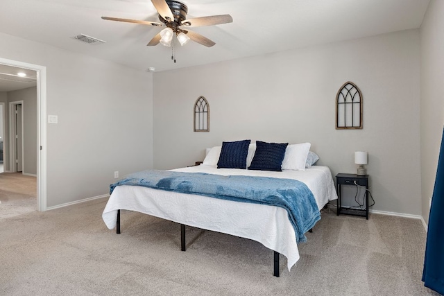 bedroom featuring carpet floors, a ceiling fan, visible vents, and baseboards