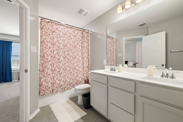 full bathroom with a sink, visible vents, and double vanity