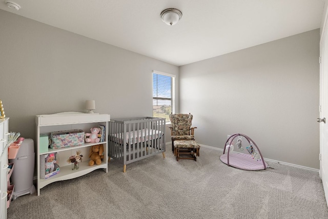 bedroom with baseboards and carpet floors