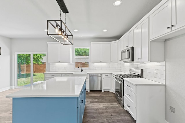kitchen featuring recessed lighting, tasteful backsplash, appliances with stainless steel finishes, and a healthy amount of sunlight