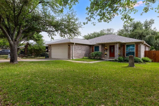 3325 Cantera Way, Round Rock, TX 78681 - ranch-style home with an attached garage, brick siding, and concrete driveway