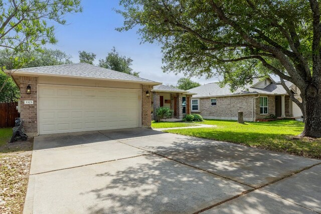 3325 Cantera Way, Round Rock, TX 78681 - ranch-style home featuring driveway, brick siding, a front lawn, and a garage