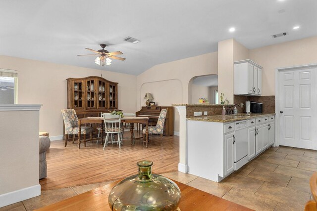 3325 Cantera Way, Round Rock, TX 78681 - kitchen featuring a ceiling fan, white dishwasher, light stone counters, tasteful backsplash, and baseboards