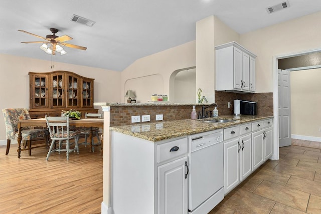 3325 Cantera Way, Round Rock, TX 78681 - kitchen with white dishwasher, a ceiling fan, tasteful backsplash, a sink, and white cabinets