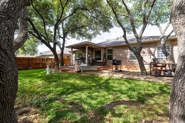 3325 Cantera Way, Round Rock, TX 78681 - back of house with brick siding and a patio