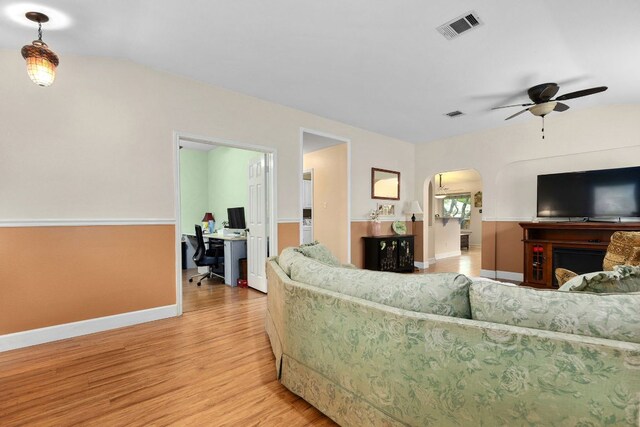 3325 Cantera Way, Round Rock, TX 78681 - living room featuring ceiling fan, a desk, light wood finished floors, and baseboards