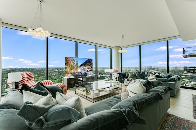 44 E Ave Unit 3906, Austin, TX 78701 - living area featuring floor to ceiling windows, healthy amount of natural light, wood finished floors, and a chandelier