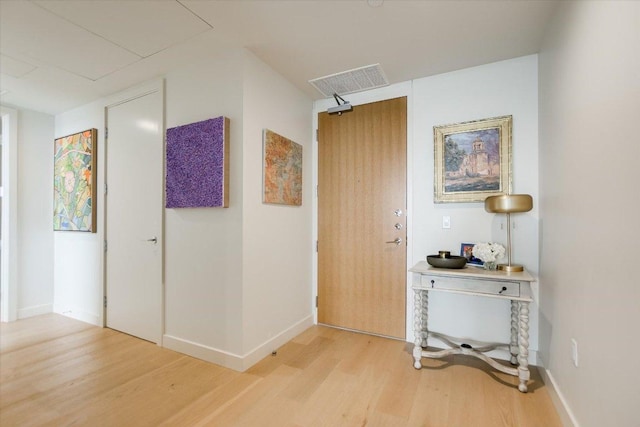 44 E Ave Unit 3906, Austin, TX 78701 - hallway featuring light wood-style floors and baseboards