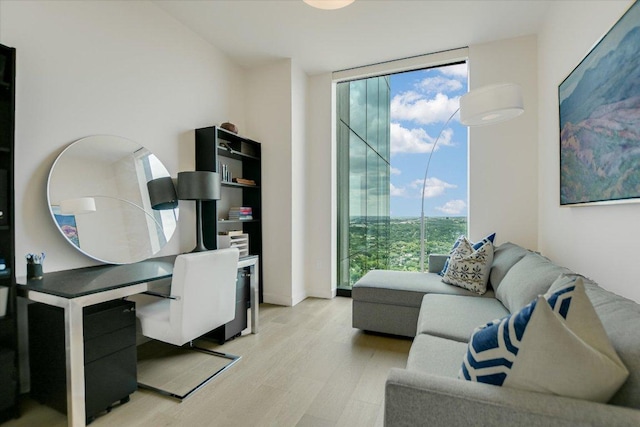 44 E Ave Unit 3906, Austin, TX 78701 - home office with expansive windows, plenty of natural light, and light wood-style flooring