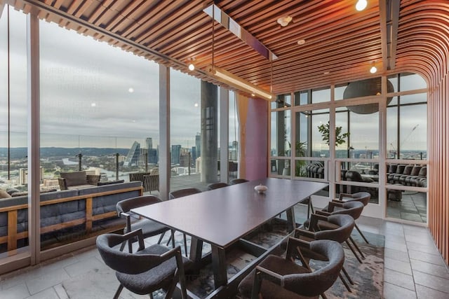 44 E Ave Unit 3906, Austin, TX 78701 - dining space with a view of city and stone tile flooring
