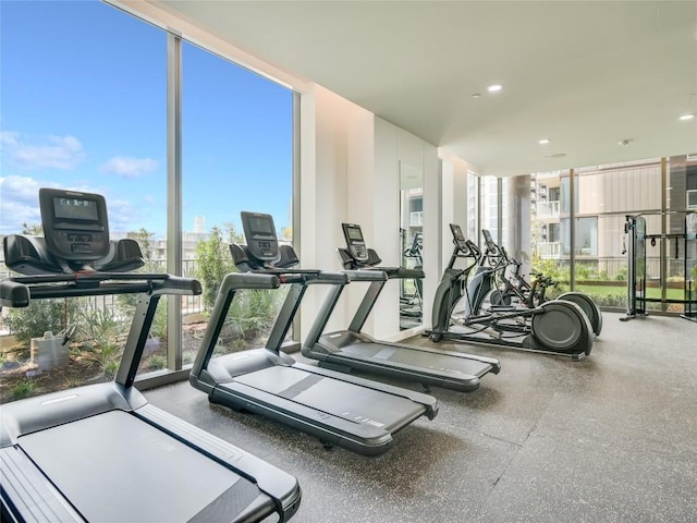 44 E Ave Unit 3906, Austin, TX 78701 - gym featuring a wall of windows and recessed lighting