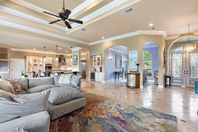 4616 High Gate Dr, Austin, TX 78730 - living room with arched walkways, light tile patterned flooring, crown molding, a ceiling fan, and recessed lighting