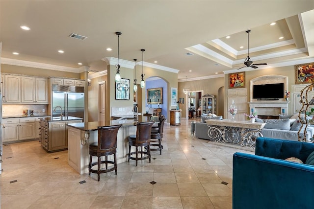 4616 High Gate Dr, Austin, TX 78730 - kitchen featuring stainless steel built in fridge, open floor plan, ceiling fan, a center island with sink, and crown molding