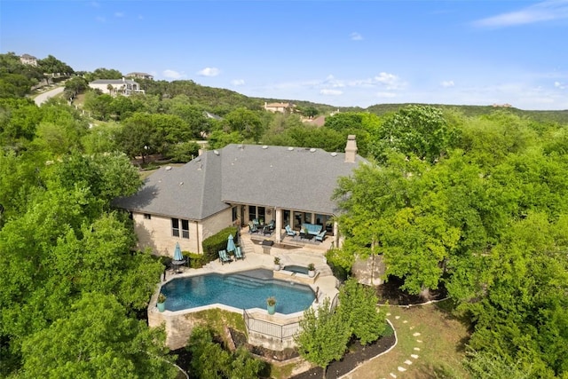 4616 High Gate Dr, Austin, TX 78730 - rear view of property with a patio, a pool with connected hot tub, and outdoor lounge area