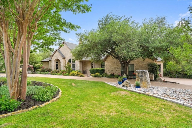 4616 High Gate Dr, Austin, TX 78730 - view of front of property featuring a front lawn, brick siding, and stone siding
