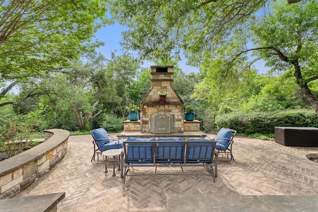 4616 High Gate Dr, Austin, TX 78730 - view of patio / terrace featuring an outdoor stone fireplace