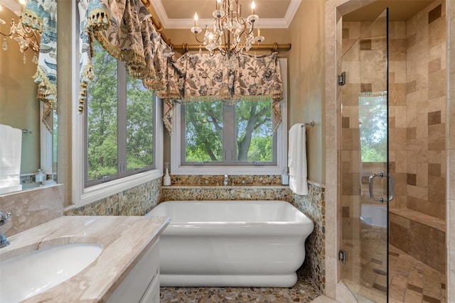 4616 High Gate Dr, Austin, TX 78730 - bathroom with a soaking tub, vanity, a stall shower, tile walls, and ornamental molding