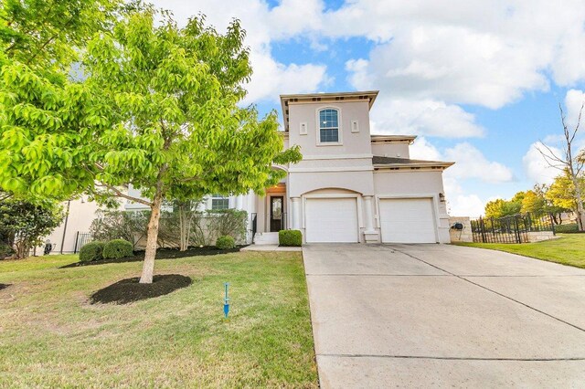 2601 Montebelluna Pl, Leander, TX 78641 - view of front of house featuring stucco siding, an attached garage, and driveway
