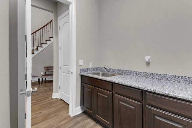 2601 Montebelluna Pl, Leander, TX 78641 - bar area with light wood-style flooring and stairs