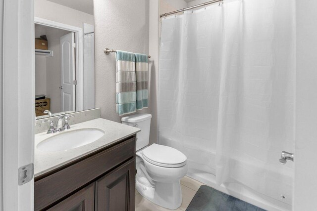 2601 Montebelluna Pl, Leander, TX 78641 - full bathroom with vanity, shower / tub combo, tile patterned flooring, and a textured wall