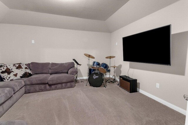2601 Montebelluna Pl, Leander, TX 78641 - carpeted living room featuring vaulted ceiling and baseboards