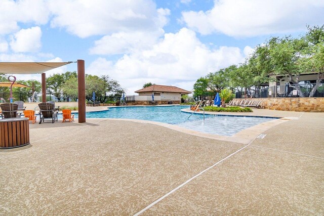 2601 Montebelluna Pl, Leander, TX 78641 - community pool featuring a patio