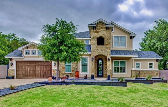 view of front of house with stucco siding, driveway, stone siding, and a front yard